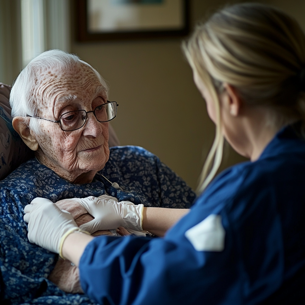 A nurse taking care of a senior citizen who has a wound that needs to be tended to at home